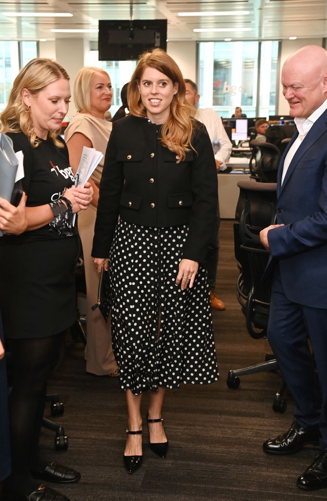 Princess Beatrice in a spotty dress in office