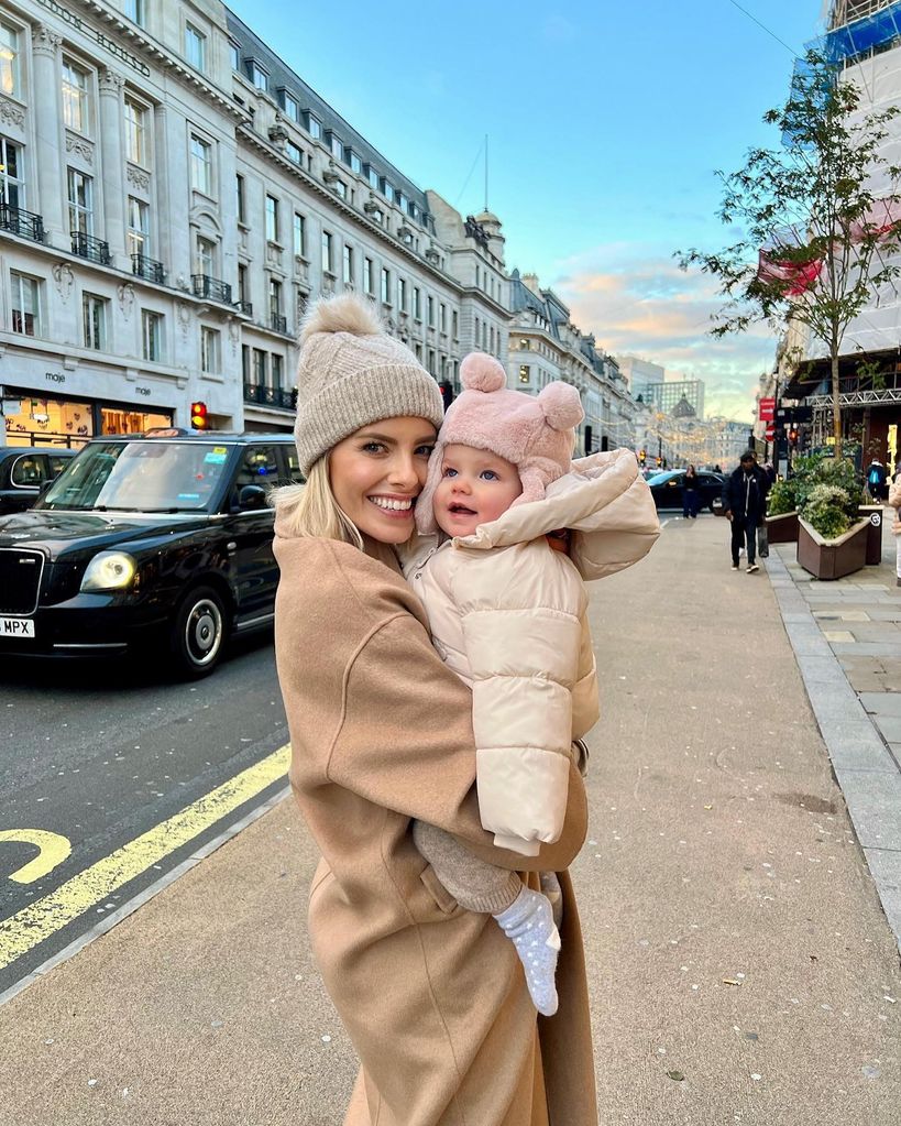 Mollie holding annabella in winter coats