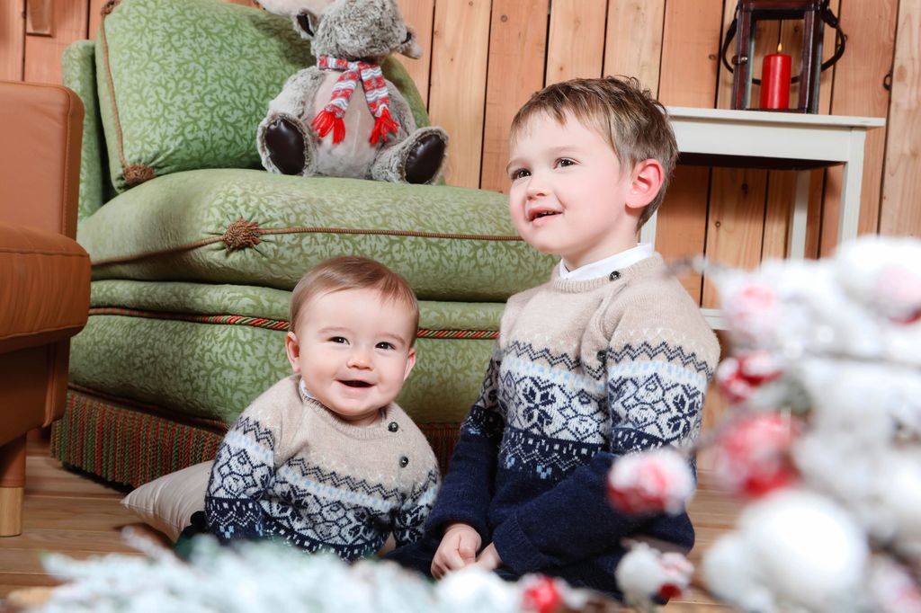 Two small boys in christmas jumpers