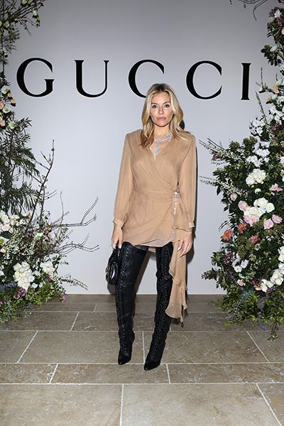 sienna miller wearing thigh high boots at gucci dinner