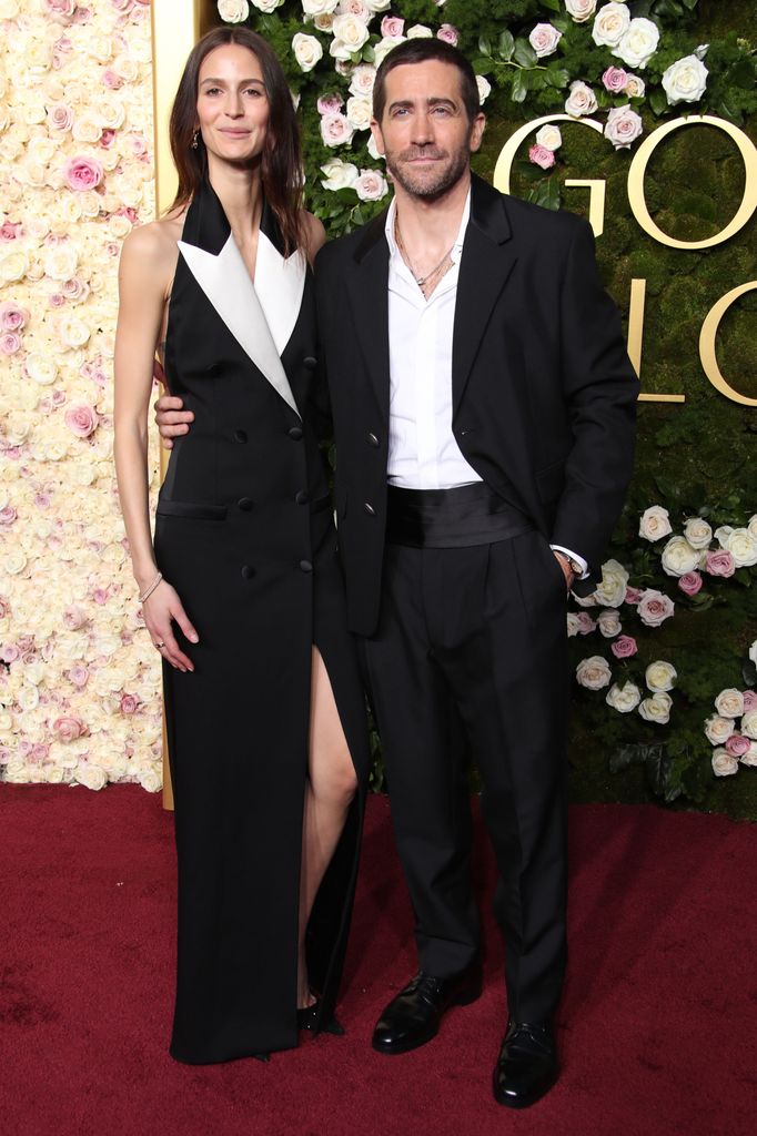 Jake Gyllenhaal in a suit with Jeanne Cadieu in a tuxedo dress