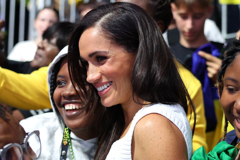 DUESSELDORF, GERMANY - SEPTEMBER 14: Meghan, Duchess of Sussex Prince, takes selfies with fans as she attends the Ukraine Nigeria Mixed Team Preliminary Round - Pool A Sitting Volleyball match during day five of the Invictus Games DÃ¼sseldorf 2023 on September 14, 2023 in Duesseldorf, Germany. (Photo by Chris Jackson/Getty Images for the Invictus Games Foundation)