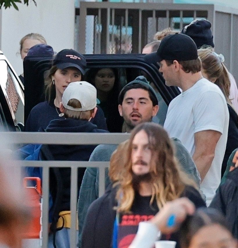 Katherine Schwarzenegger in black sweater and cap with Chris Pratt in white shirt and jeans 