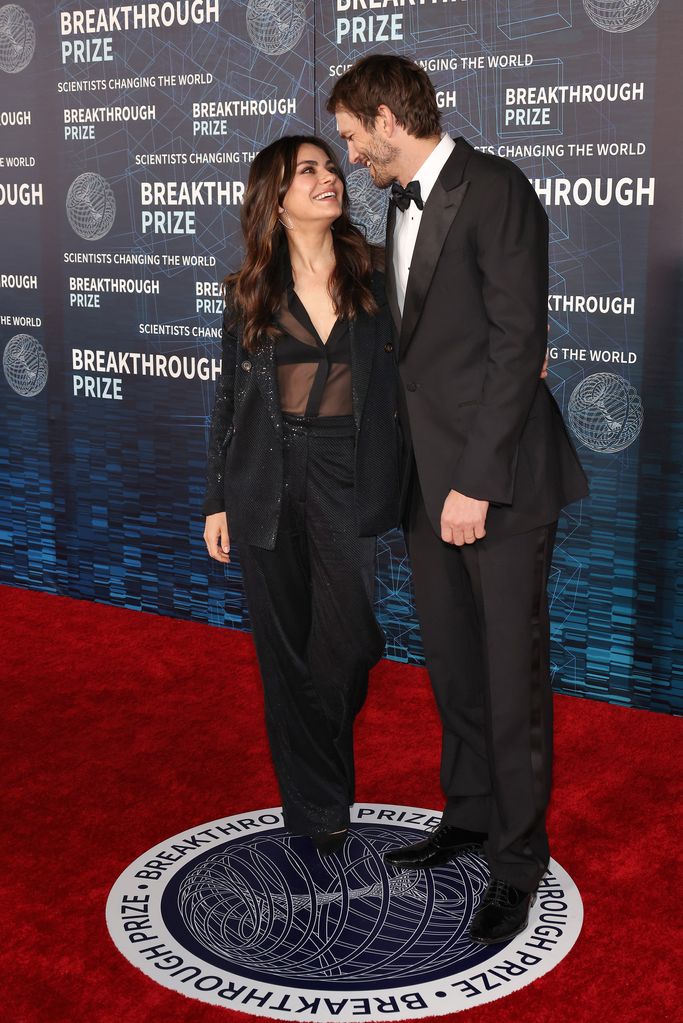Mila Kunis and Ashton Kutcher arrive at the Ninth Breakthrough Prize Ceremony at Academy Museum of Motion Pictures on April 15, 2023 in Los Angeles, California