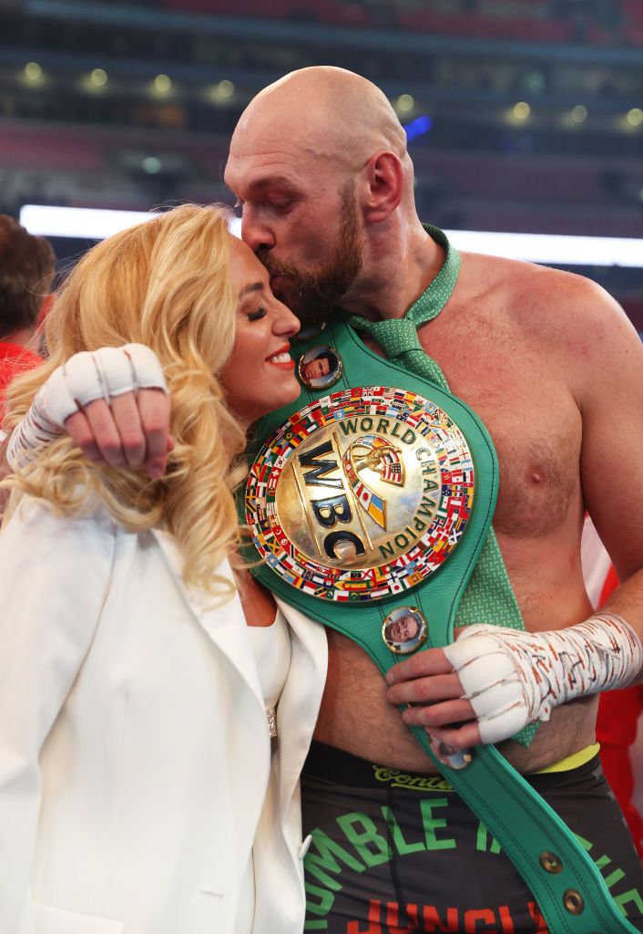 Tyson kisses Paris Fury's husband after becoming World Champion
