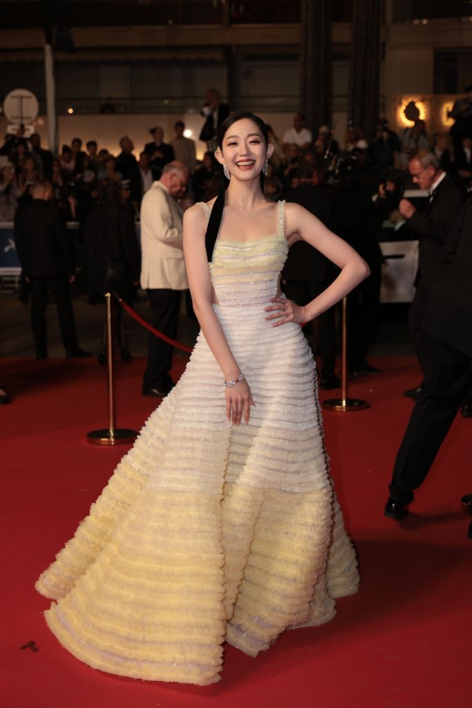Actress Wan Qianhui attends the screening of the film 'Twilight Of The Warriors: Walled In' (City Of Darkness) during the 77th Annual Cannes Film Festival at Palais des Festivals on May 16, 2024 in Cannes, France in a yellow gown