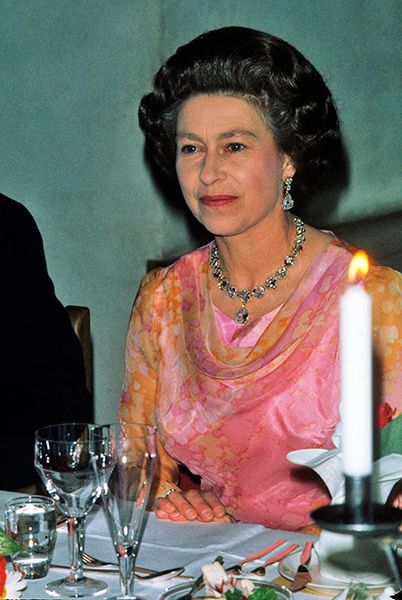the queen by a candle