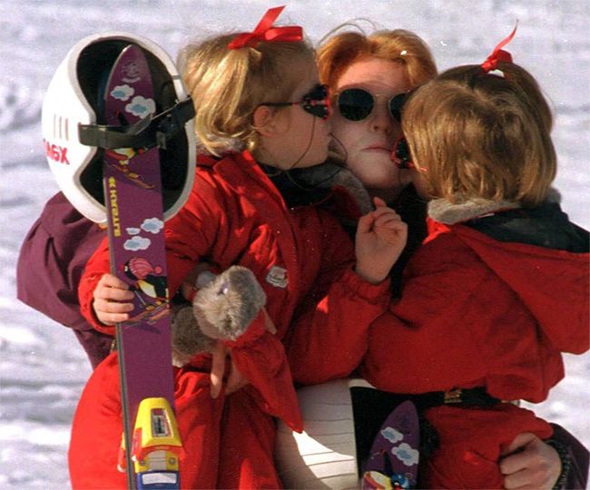 sarah ferguson being kissed by eugenie and beatrice