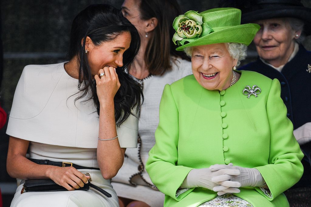 Meghan Markle laughing with Queen Elizabeth II