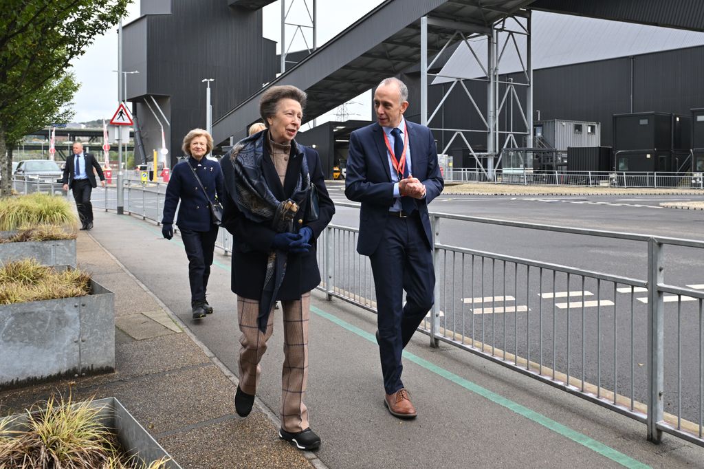 Princess Anne walking outside with a man