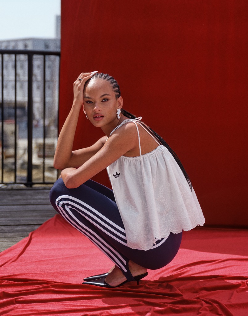 A model poses in the new Asos x Adidas collab
