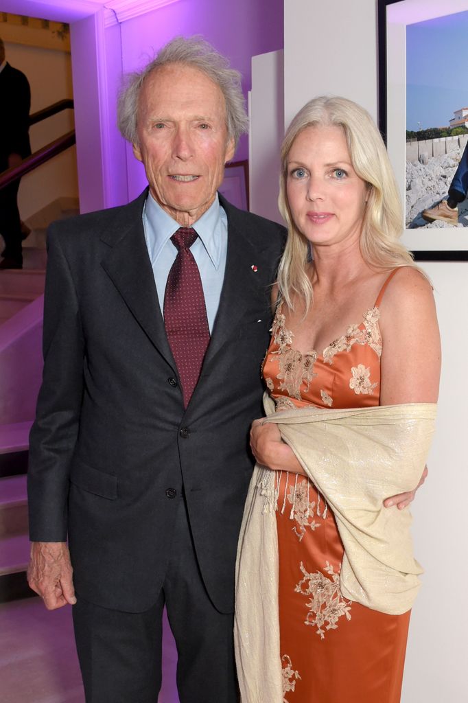 Clint Eastwood (L) and Christina Sandera attend the Vanity Fair and Chopard Party celebrating the Cannes Film Festival at Hotel du Cap-Eden-Roc