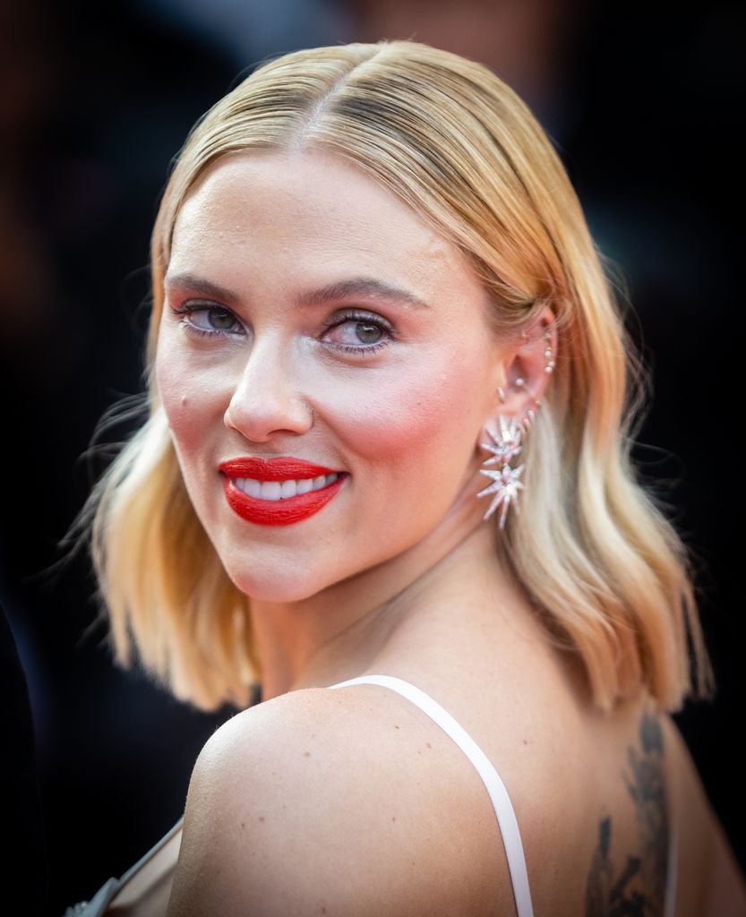 Scarlet Johansson exposes her back tattoo in peek-a-boo bra