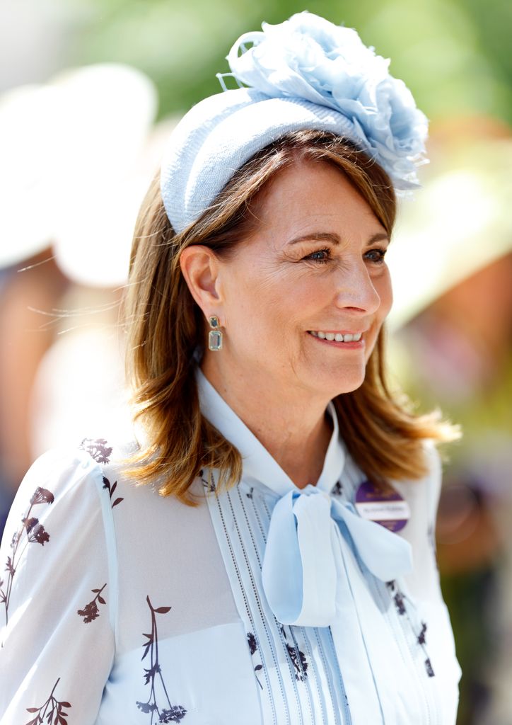 Carole Middleton side on in blue dress and hat