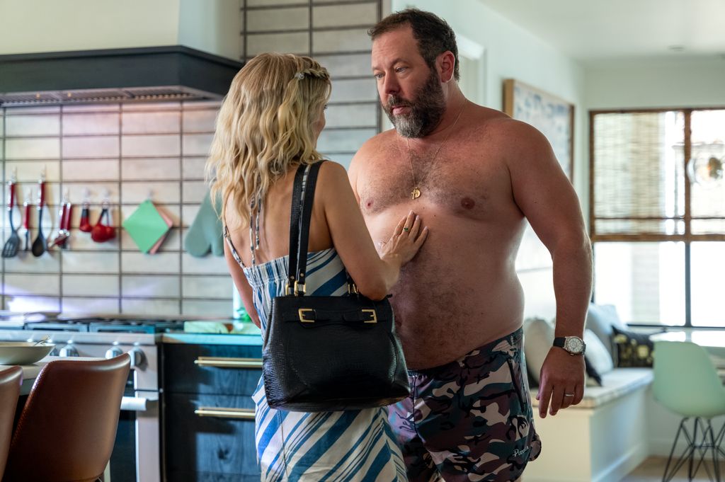 Arden Myrin and a shirtless Bert Kreischer in a still from Free Bert
