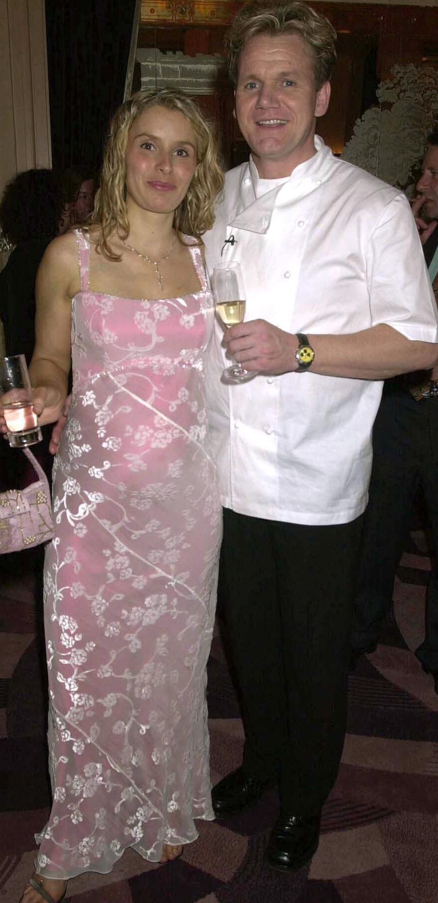 Gordon Ramsey with his pregnant wife Tana in a pink dress