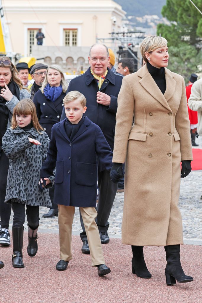 Charlene in tan coat with kids and albert 