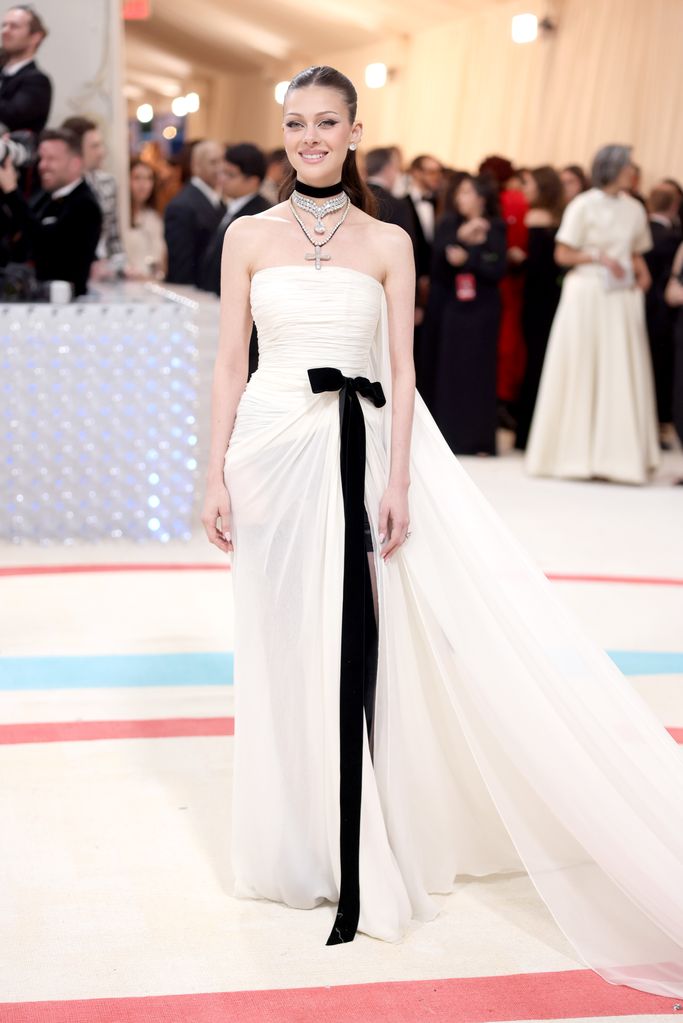 Nicola Peltz wears a white strapless gown at the 2023 Met Gala 