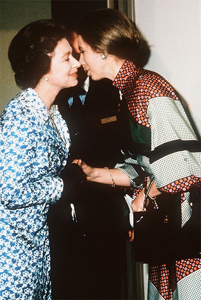 The Queen and Princess Anne share a kiss