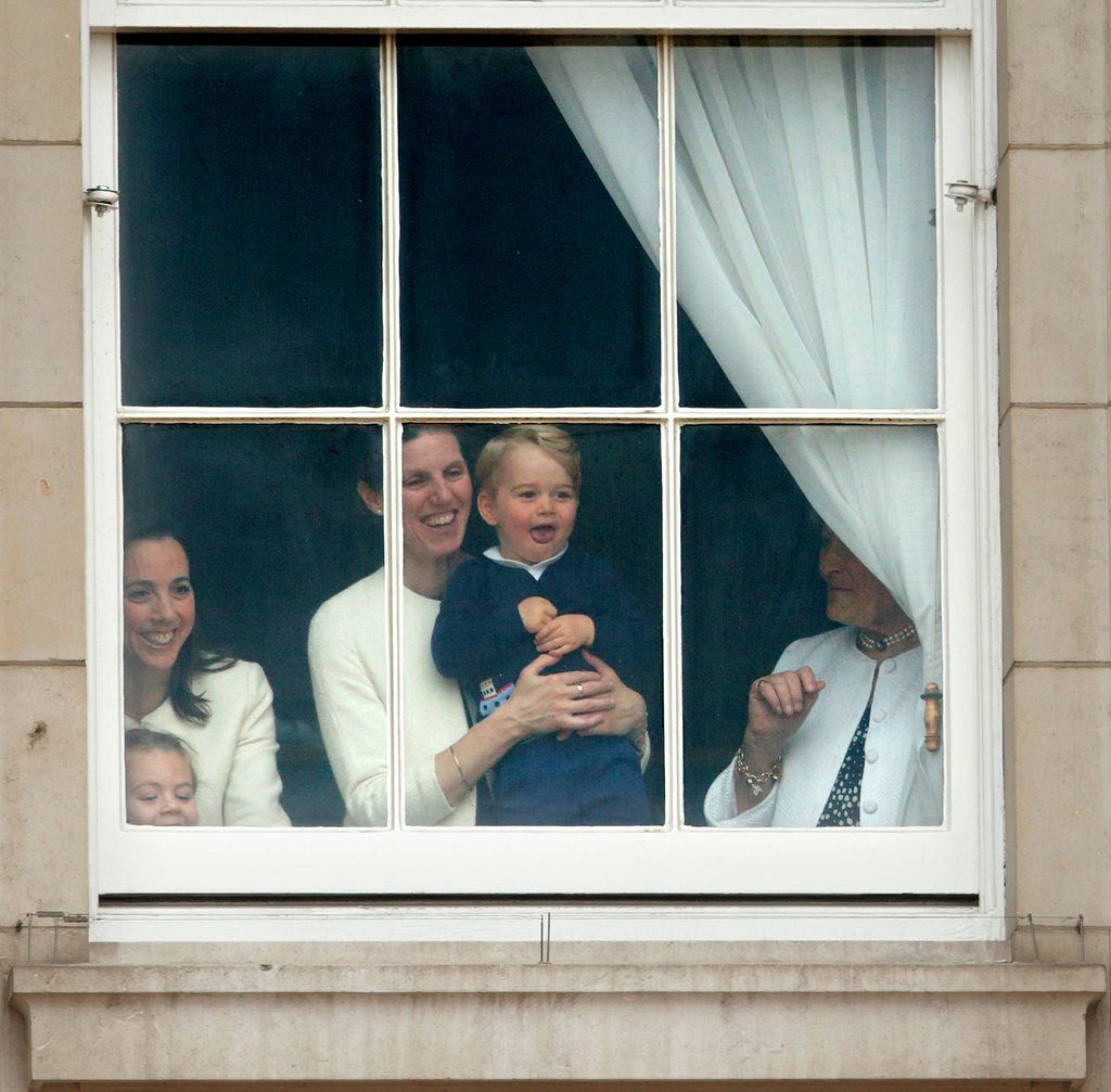 Maria Teresa Turrion Borrallo holding Prince George at a window
