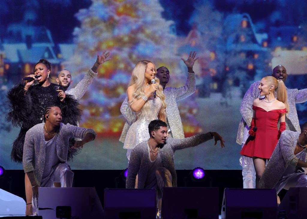 (L-R) Jennifer Hudson, Mariah Carey, and Ariana Grande perform during Mariah Carey's "Merry Christmas One And All!" at Madison Square Garden 