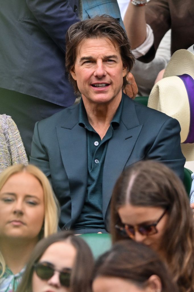 Tom looked very happy to be watching the tennis