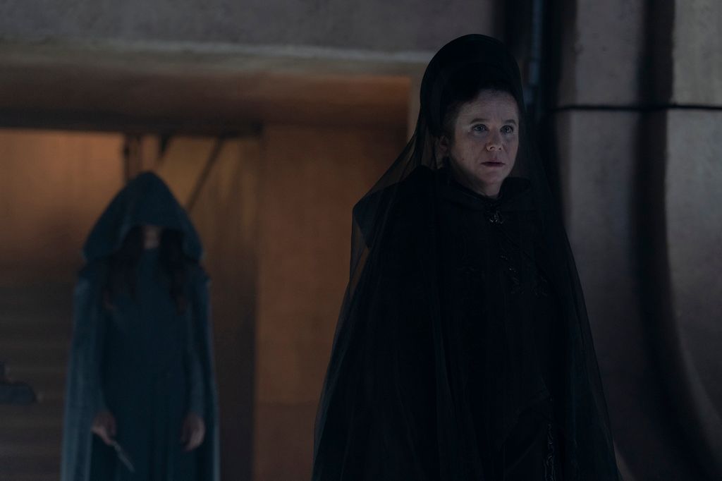 Emily Watson in a black funeral dress in a scene from Dune: Prophecy