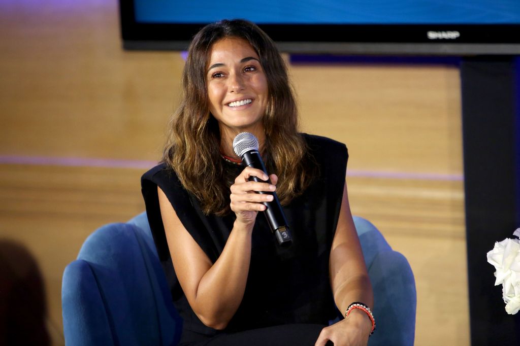 Emmanuelle Chriqui black shirt microphone
