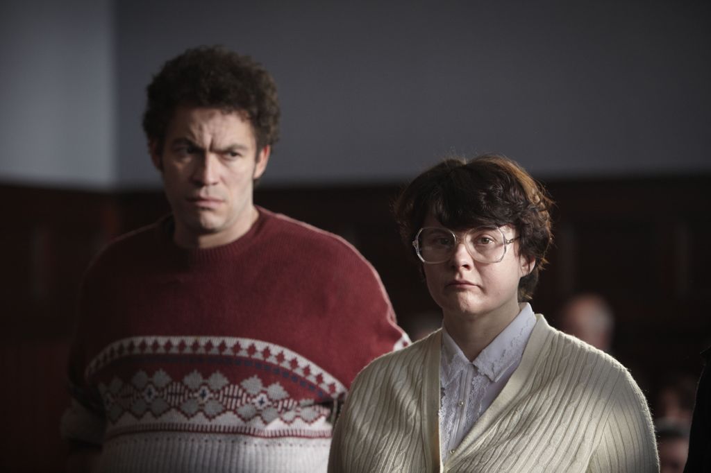 man and woman standing in court