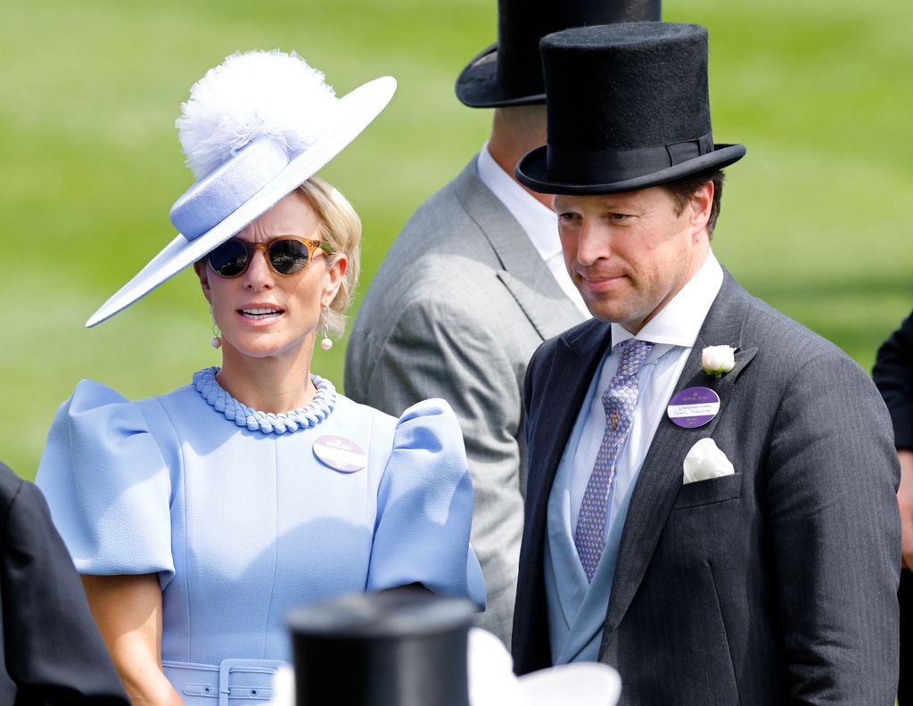 two people dressed smartly at royal ascot 