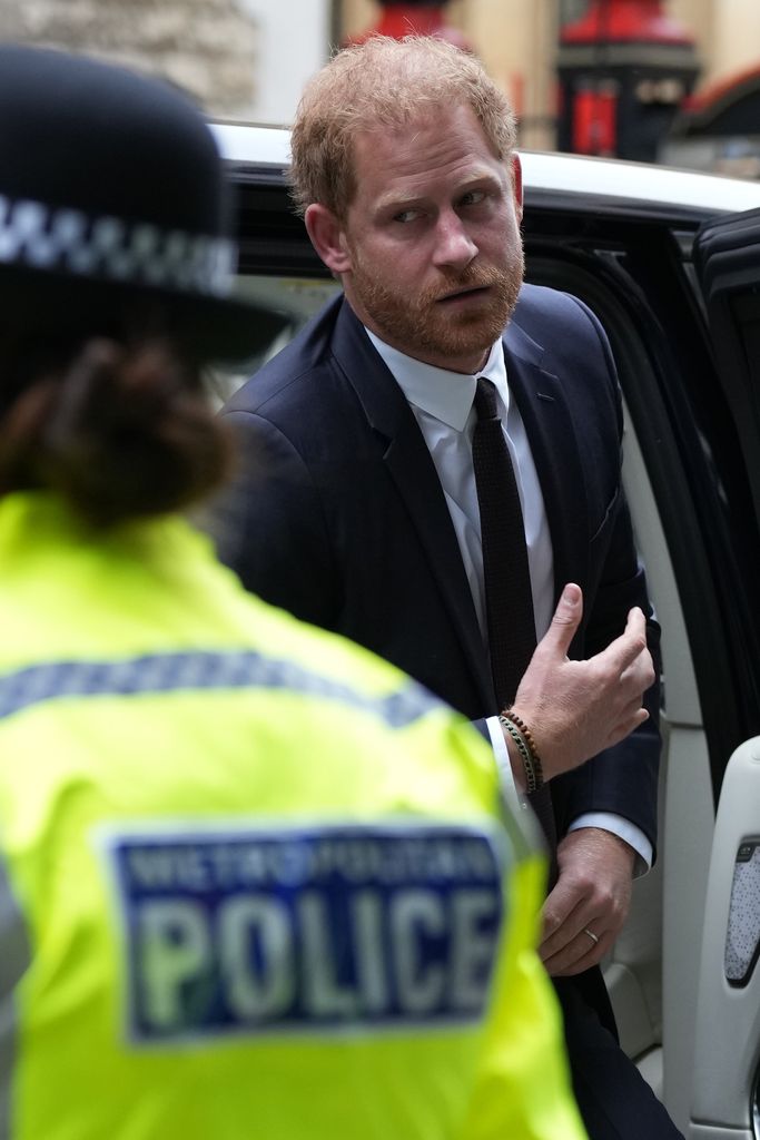 Prince Harry looking downcast at court 