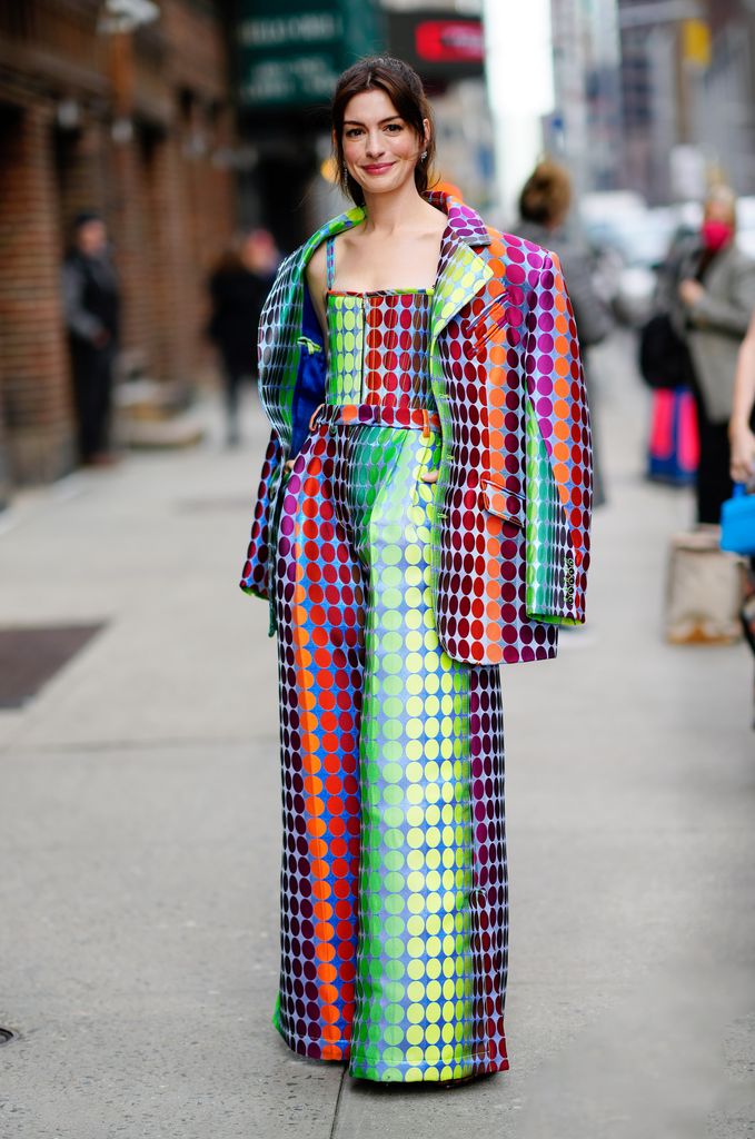 anne hathaway in raibow spotted jumpsuit