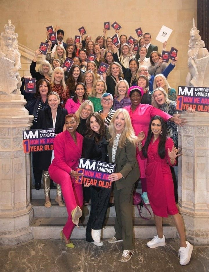 Penny Lancaster smiling in Westminster with a group of women