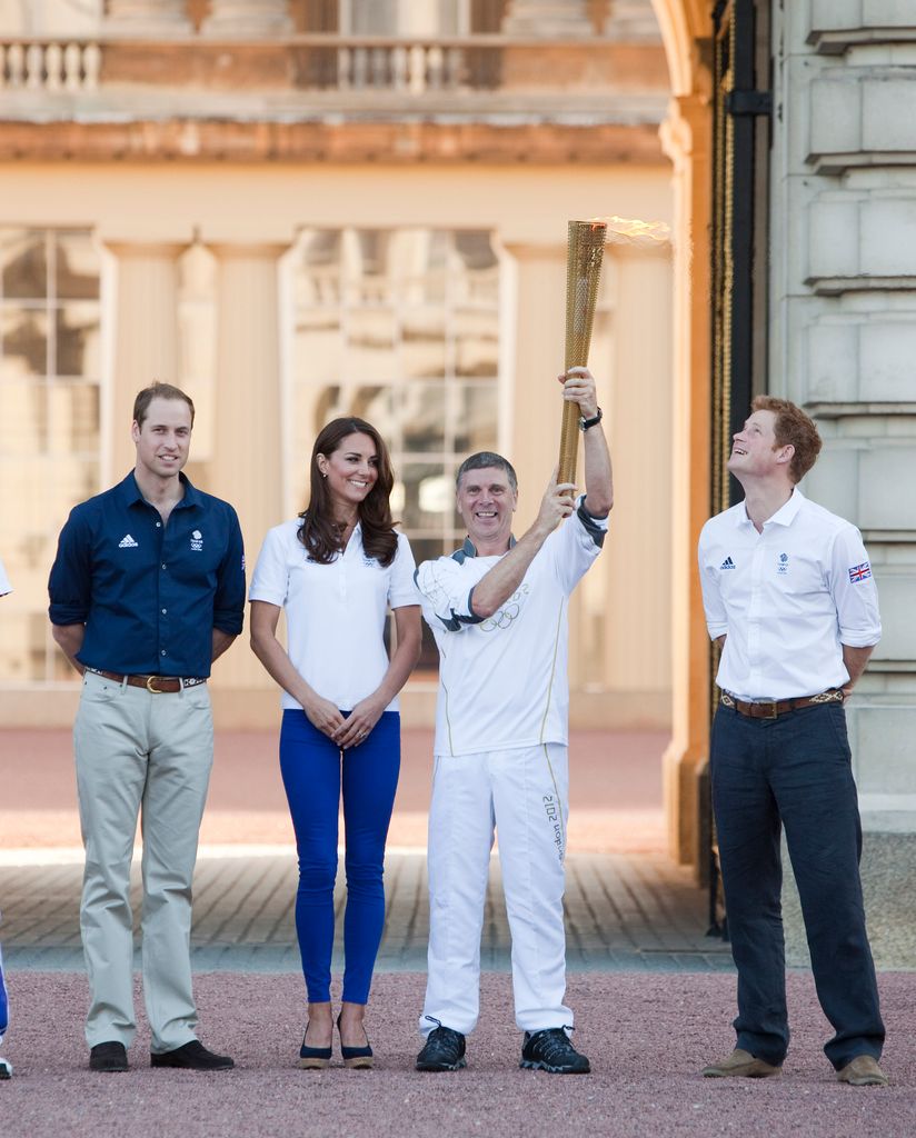 Kate beside william, torch bearer and harry in skinny jeans