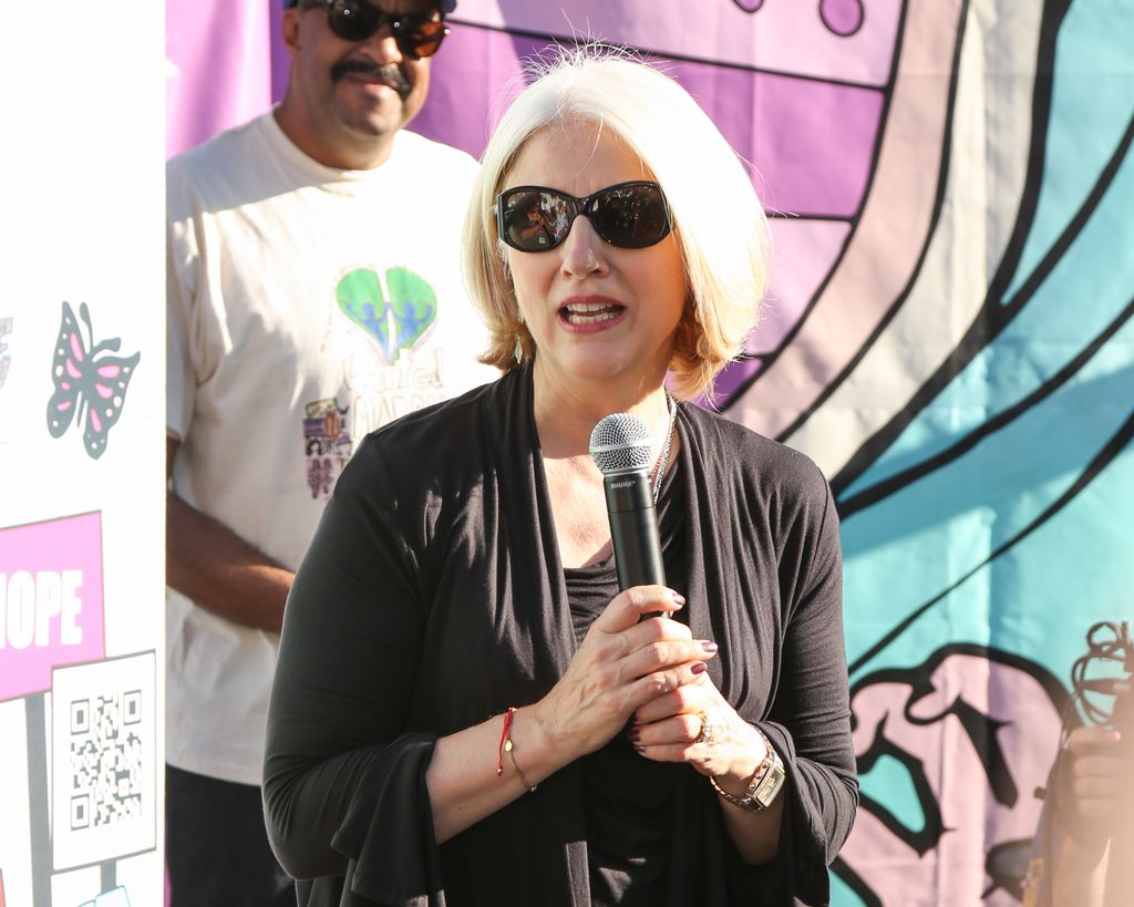 Cynthia Germanotta speaking into a microphone