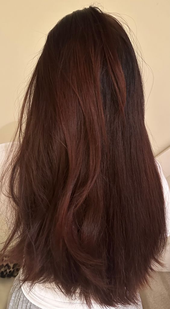 brown hair styled on the left side and unstyled on right 