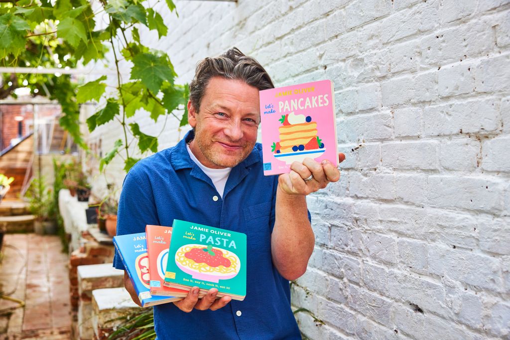 Jamie Oliver holding books