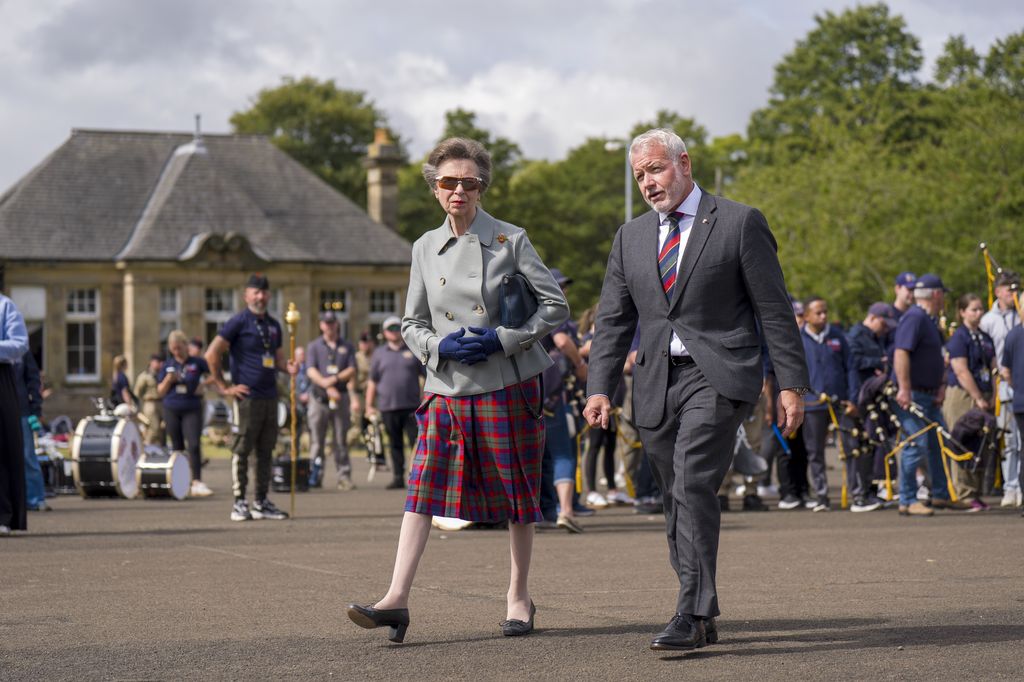 The Princess Royal with CEO Jason Barrett during a rehearsal for this year's Royal Edinburgh Military Tattoo at Redford Barracks in Edinburgh. The Royal Edinburgh Military Tattoo is an annual series of military tattoos performed by British Armed Forces, Commonwealth and international military bands, and artistic performance teams on the Esplanade of Edinburgh Castle in the capital of Scotland. The event is held each August as one of the Edinburgh Festivals. Picture date: Wednesday July 30, 2025. (Photo by Jane Barlow/PA Images via Getty Images)