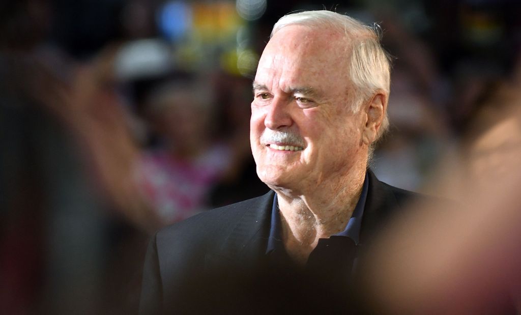 man at film festival in black suit 