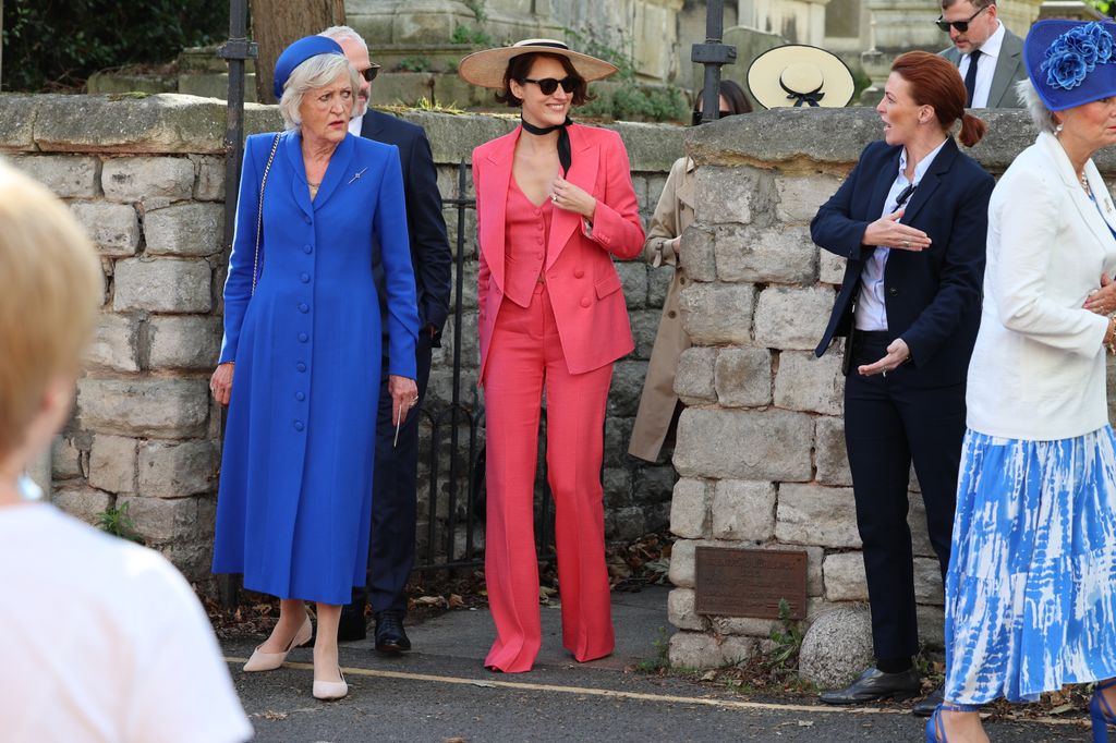 Phoebe Waller-Bridge was all smiles in a vibrant coral suit to attend her brother's wedding