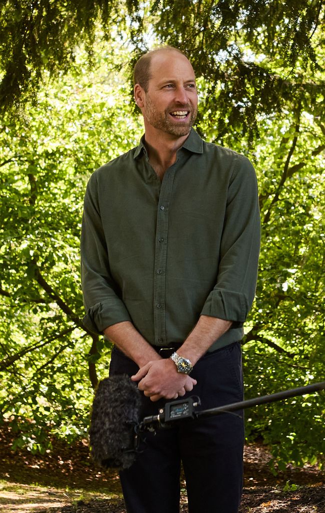 Prince William smiling in garden wearing khaki shirt