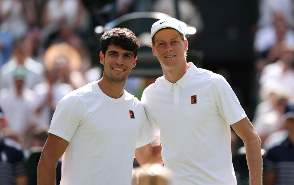 Carlos Alcaraz of Spain and Jannik Sinner of Italy pose for a photo at the net prior to the Gentleman's Singles Final on day fourteen of The Championships Wimbledon 2025 at All England Lawn Tennis and Croquet Club on July 13, 2025 in London, England.