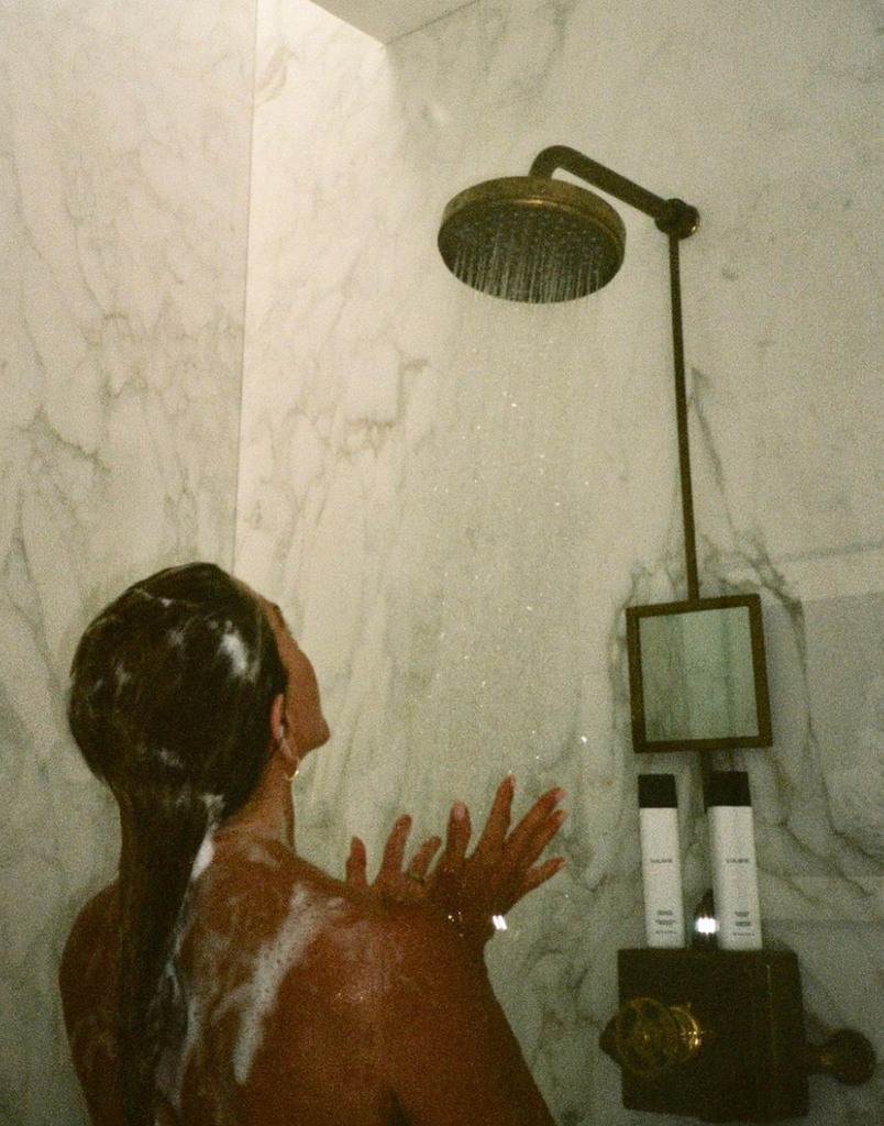Photo shared by Jennifer Aniston on Instagram September 2022, in the shower promoting her brand Lolavie