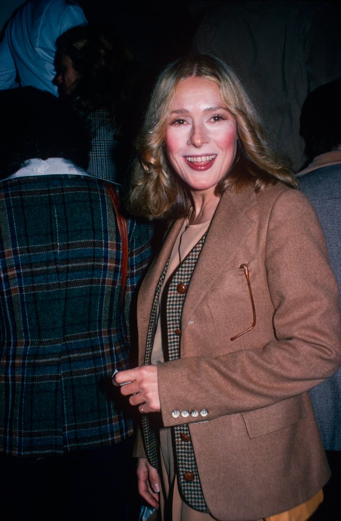 Kathleen Turner in a tan wool jacket