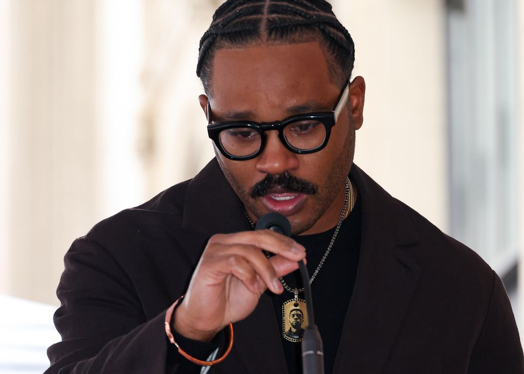 Ryan Coogler wears a bracelet gifted to him by Chadwick Boseman at the ceremony posthumously honoring the later actor with a Star on The Hollywood Walk Of Fame 