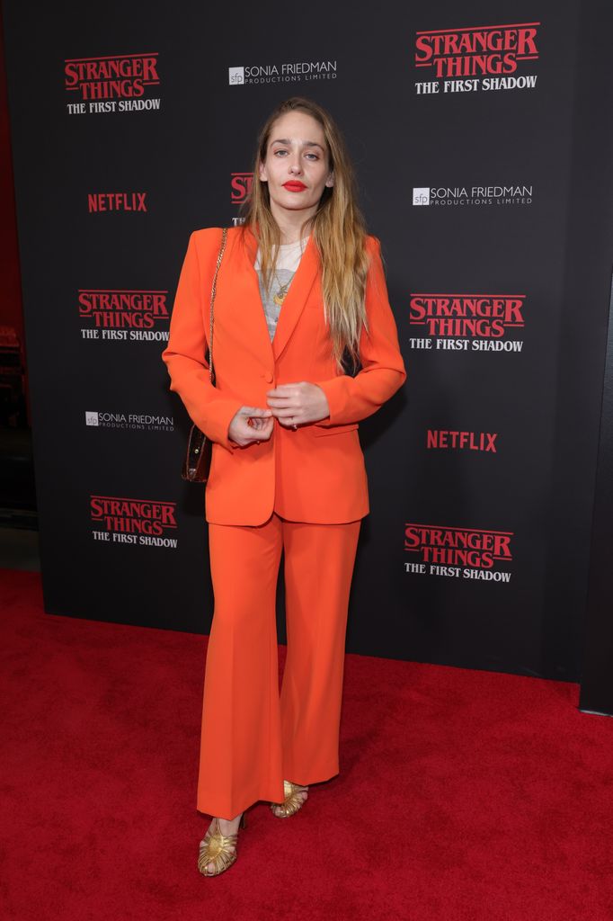 Jemima Kirke at the "Stranger Things: The First Shadow" opening night in orange suit