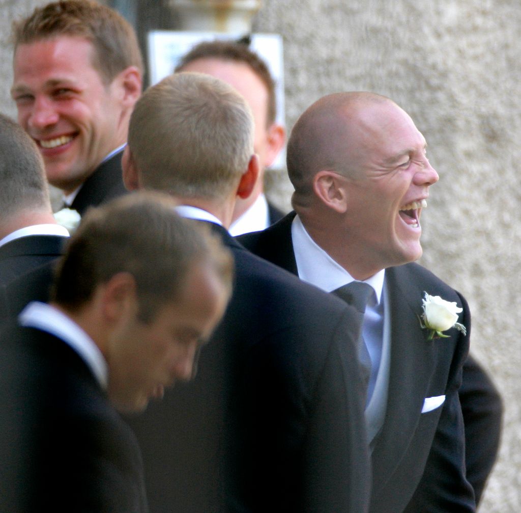 Mike Tindall laughing with his groomsmen at Canongate Kirk for his wedding