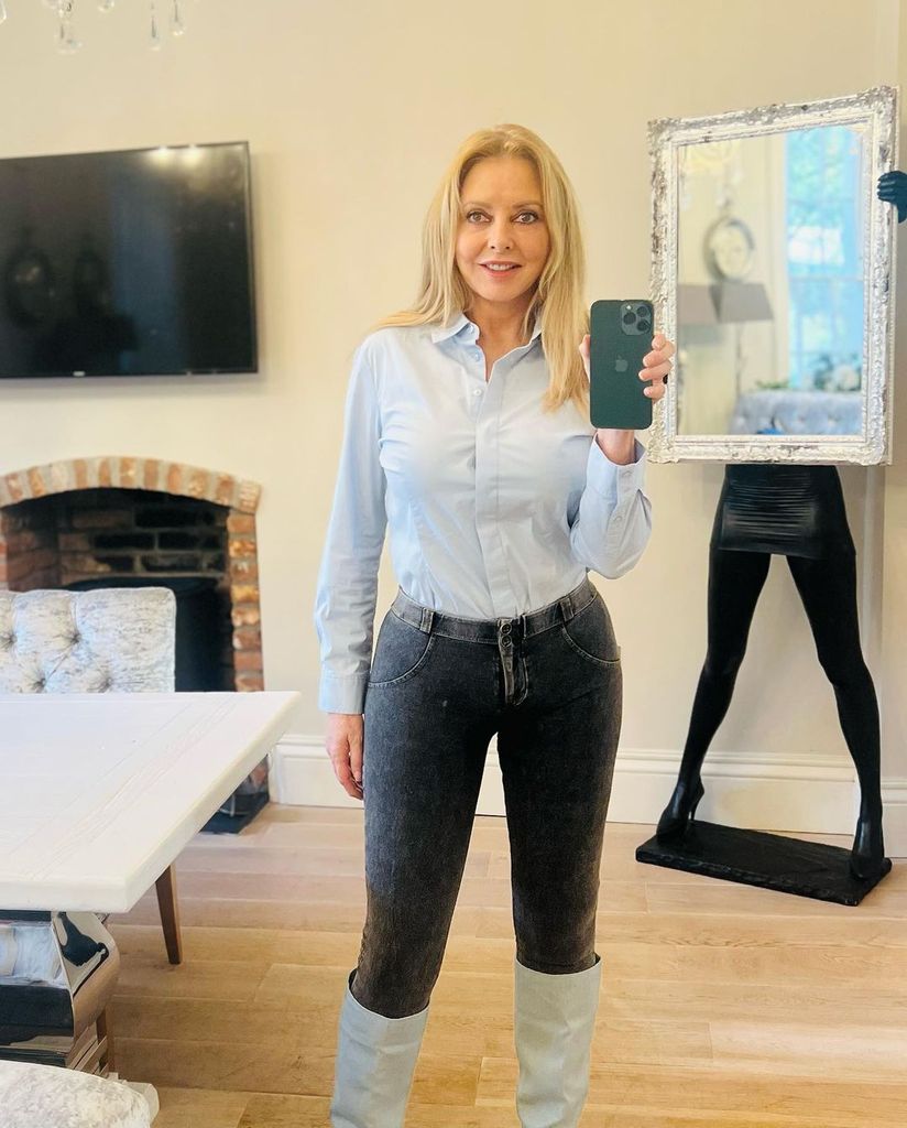 carol vorderman wearing shirt, jeans and boots 