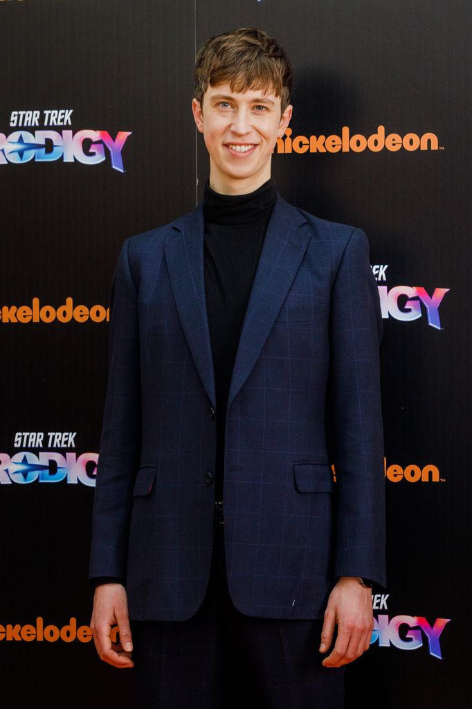 Angus Imrie at a Star Trek premiere in a blue suit
