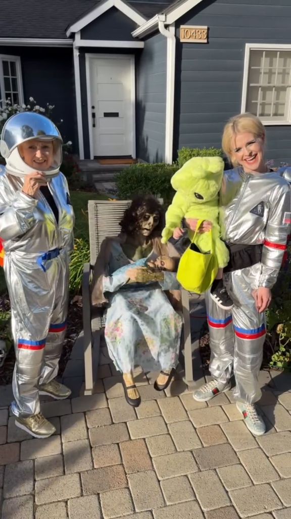 Kelly Osbourne in a space outfit with her son in an alien onesie